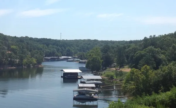 Covered boat docks along the shoreline of Grand Lake.